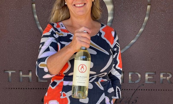 Lady holding a bottle of viognier