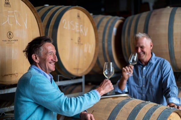 Jacques and Yale enjoying The Islander Estate wine
