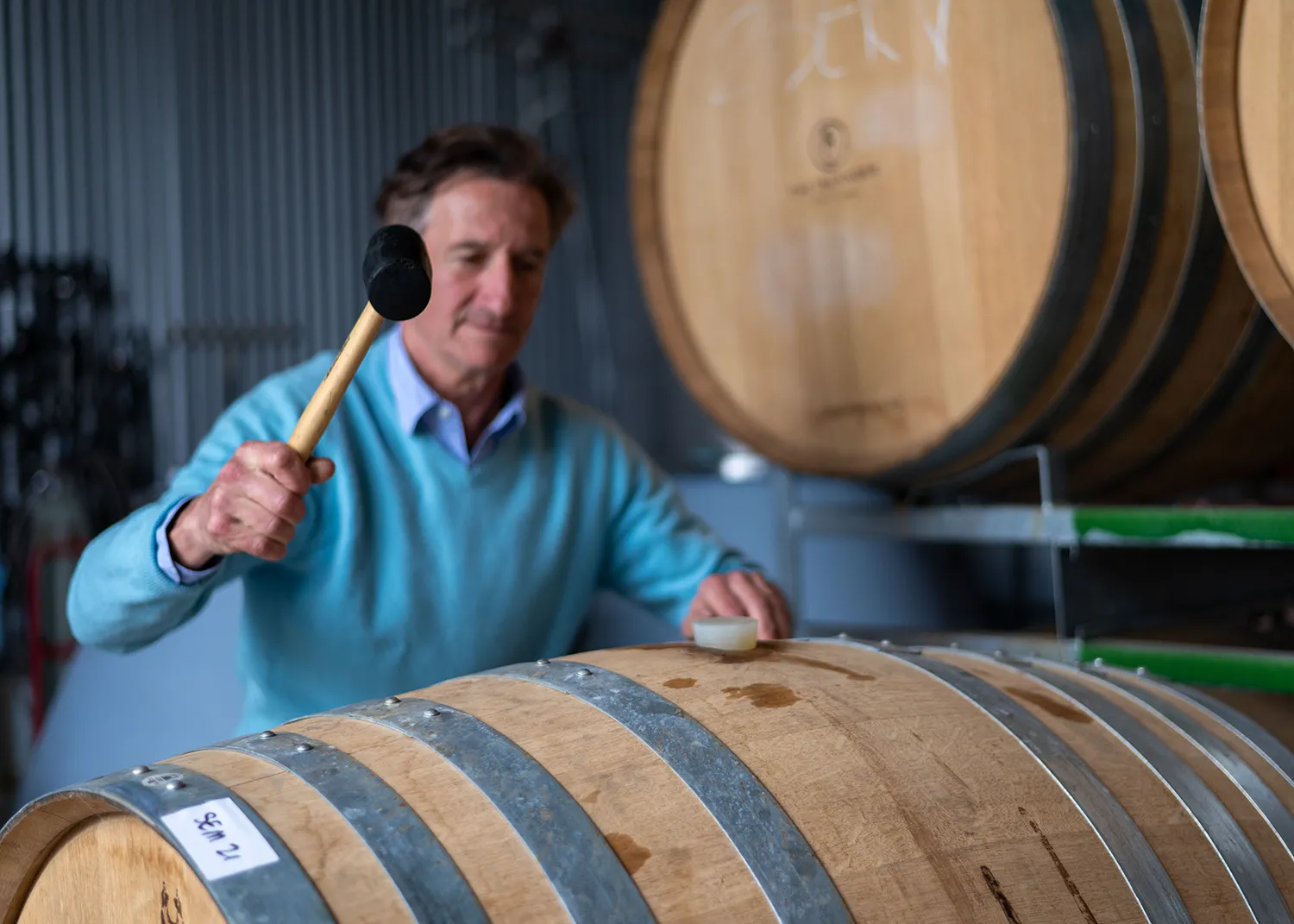 Jacques Lurton sealing a wine barrel