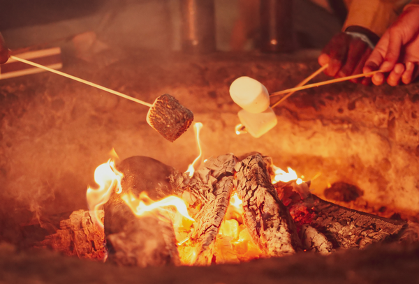 Roasting marshmallows by a fire
