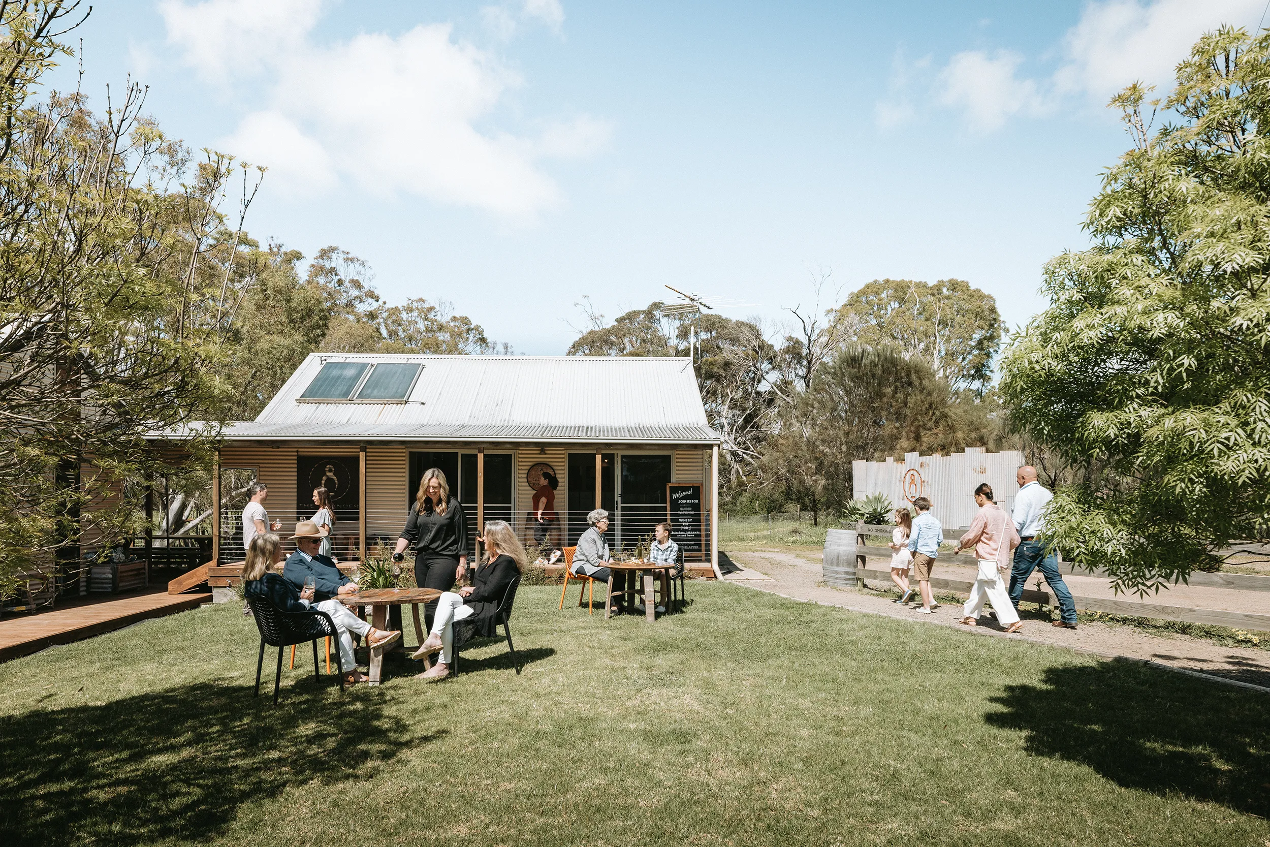 Guests on the lawn at The Islander Estate Vineyards