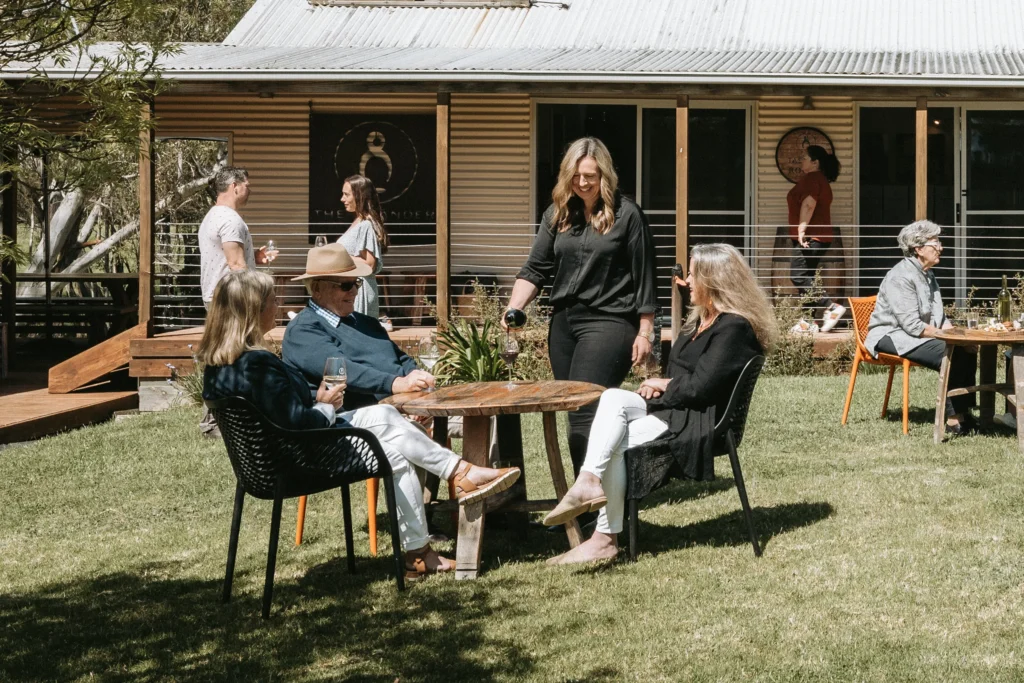 Guests on the lawn at The Islander Estate Vineyards